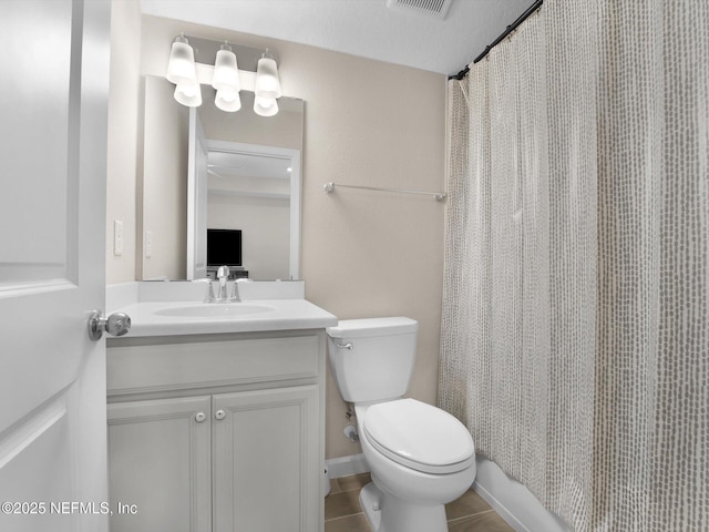 bathroom with toilet, vanity, tile patterned flooring, a shower with curtain, and a textured ceiling