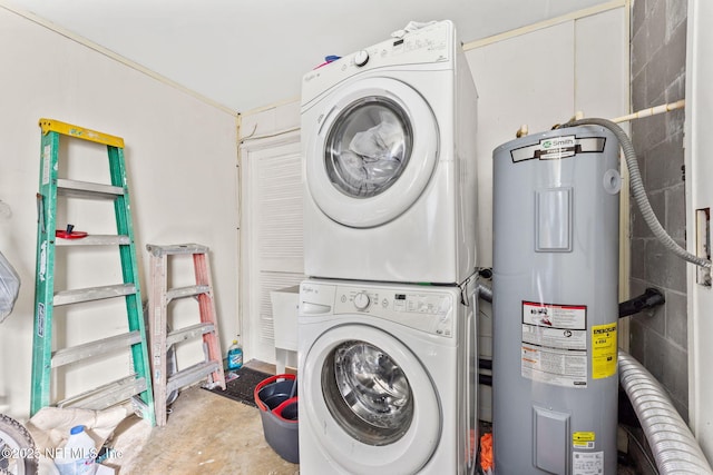 laundry room featuring stacked washing maching and dryer and water heater