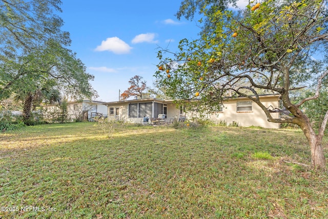 view of yard with a sunroom