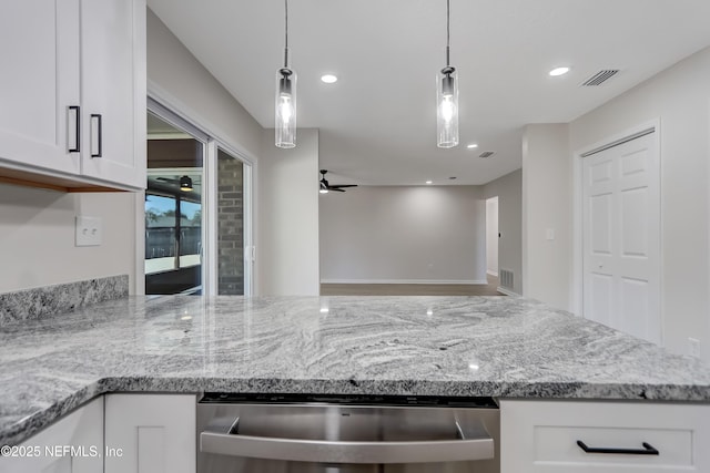 kitchen featuring white cabinetry, ceiling fan, and decorative light fixtures