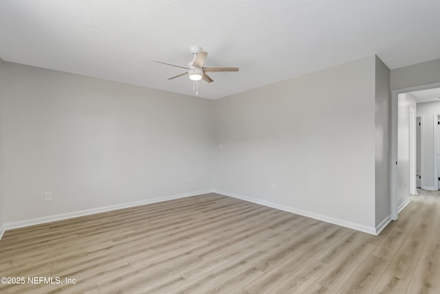 spare room featuring ceiling fan and light hardwood / wood-style flooring