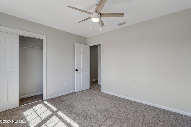 unfurnished bedroom featuring a closet, ceiling fan, and carpet flooring