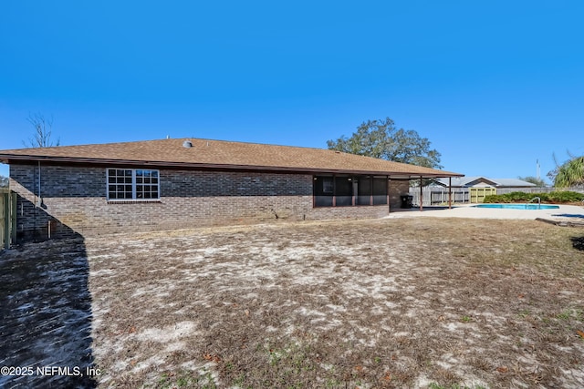 rear view of property featuring a patio area