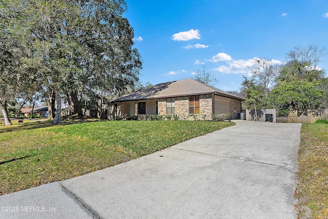 ranch-style house with a front yard and a garage