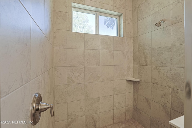 bathroom featuring tiled shower