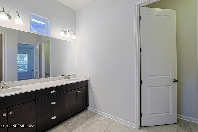 bathroom with tile patterned flooring and vanity