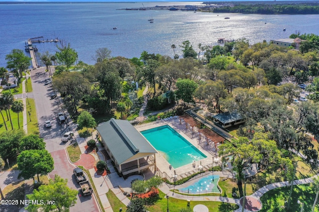 birds eye view of property with a water view