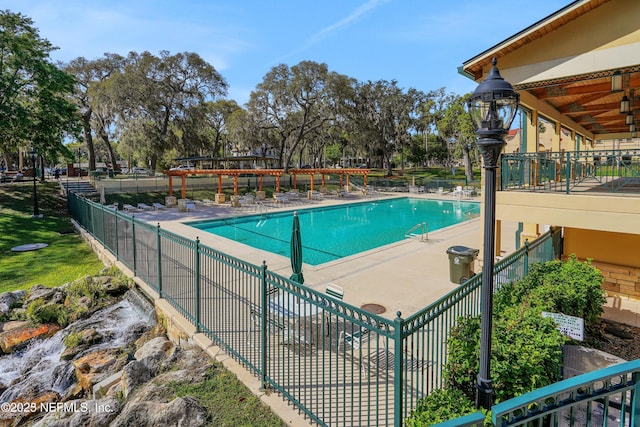 view of swimming pool with a patio