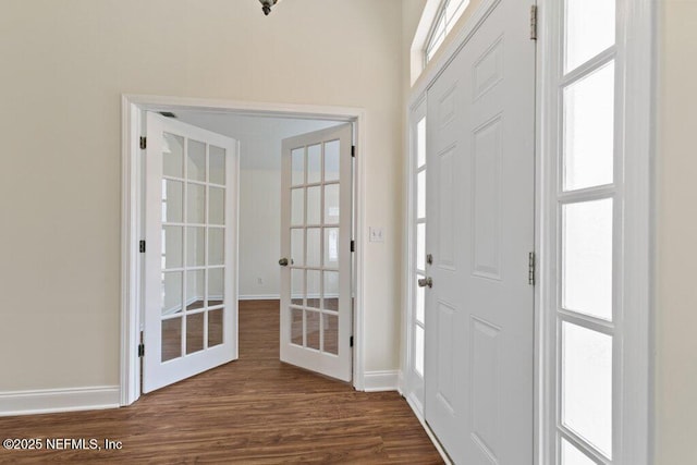 entrance foyer with french doors and dark hardwood / wood-style flooring