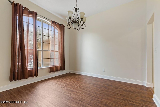 interior space with a notable chandelier and dark wood-type flooring