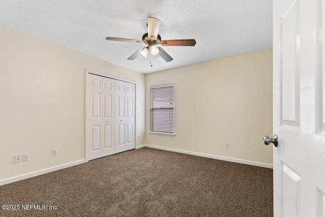 unfurnished bedroom featuring a closet, ceiling fan, and dark colored carpet