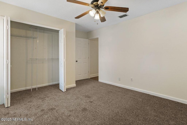 unfurnished bedroom with a closet, ceiling fan, and carpet flooring