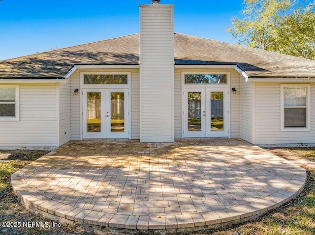 back of property with french doors and a patio area