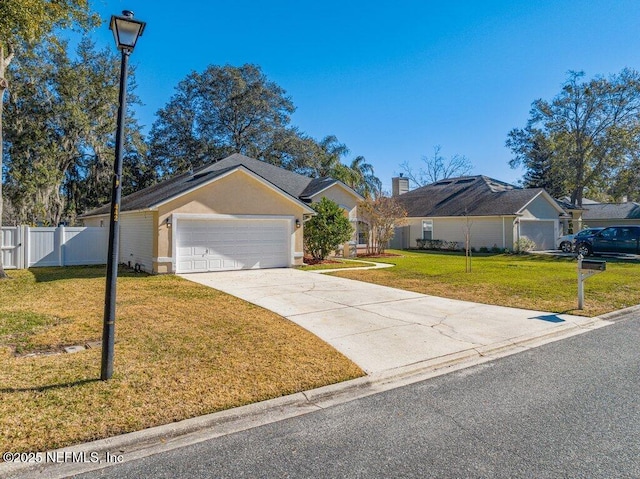 single story home with a garage and a front lawn