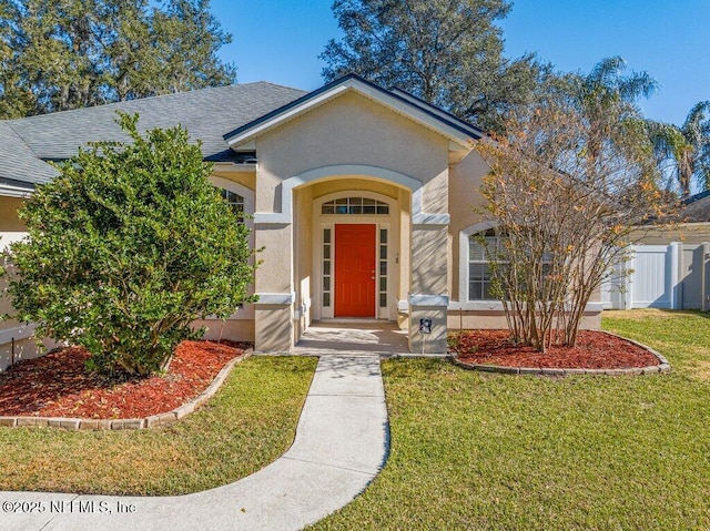 view of front of home with a front lawn