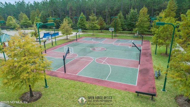 view of basketball court featuring a yard