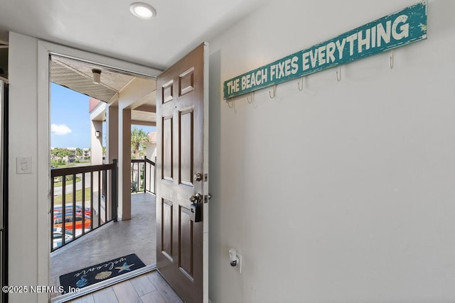 doorway to outside with wood-type flooring