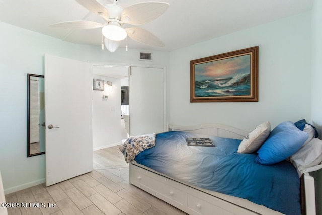 bedroom featuring ceiling fan and light hardwood / wood-style flooring