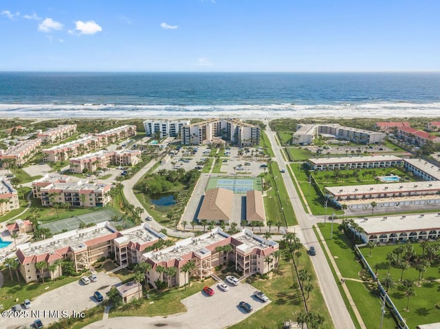 aerial view featuring a water view and a beach view