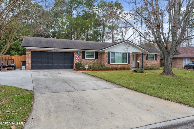 ranch-style house featuring a garage and a front yard