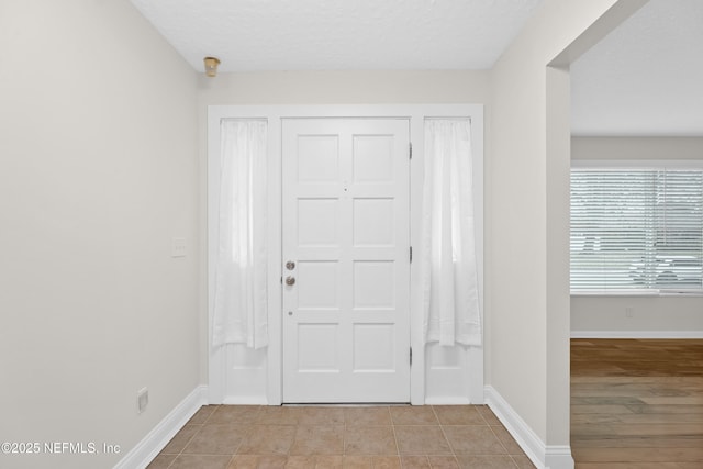 entrance foyer with light tile patterned floors