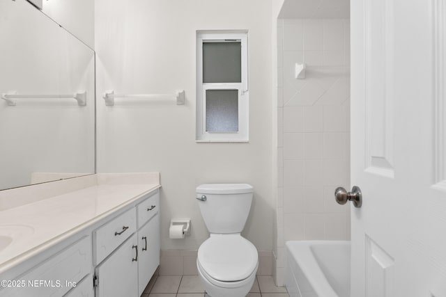 full bathroom with tile patterned floors, vanity, toilet, and tiled shower / bath