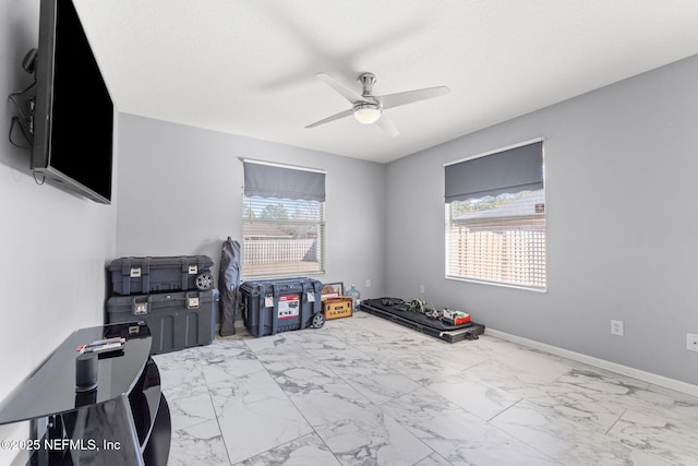 interior space featuring a textured ceiling and ceiling fan