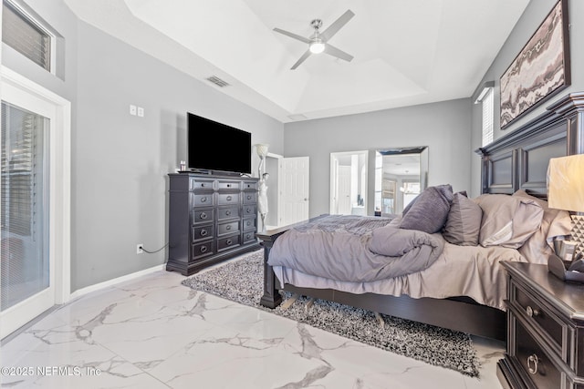 bedroom featuring a tray ceiling and ceiling fan