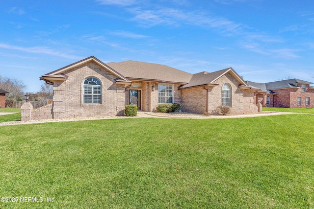 ranch-style house featuring a front yard