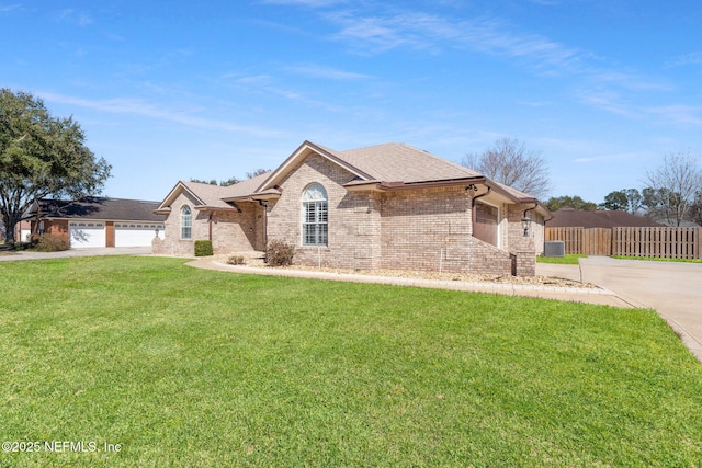 ranch-style house with a garage and a front yard