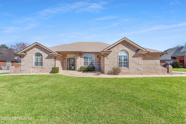 ranch-style home with a front yard