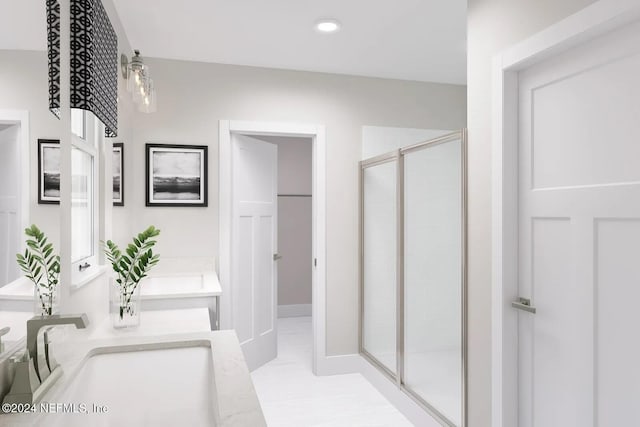 bathroom featuring vanity and a shower with shower door