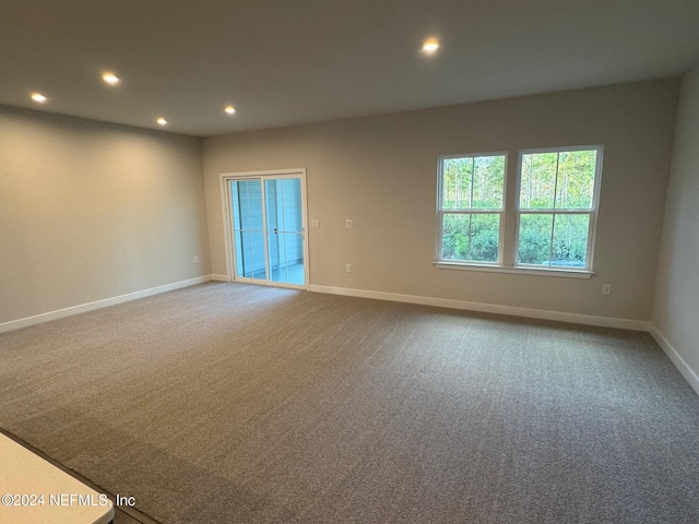 unfurnished room with carpet floors