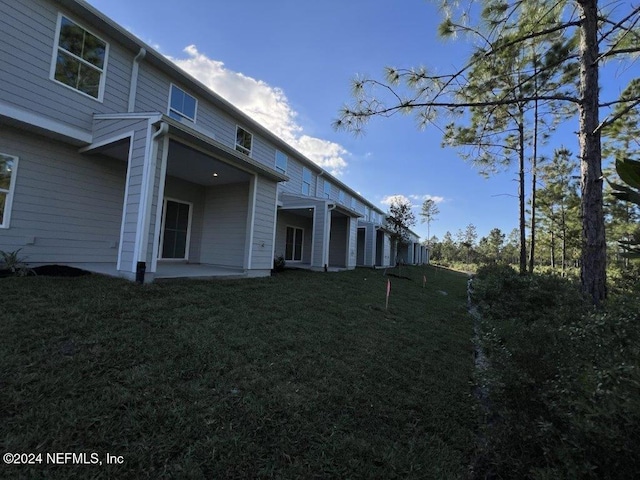 exterior space featuring a patio area and a yard