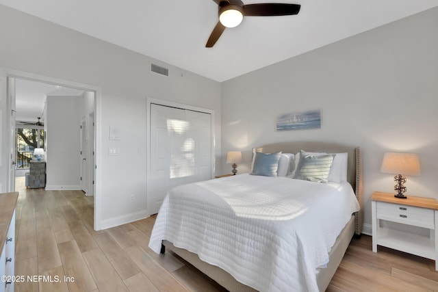 2003 Windjammer Ln, Saint Augustine, FL 32084 - bedroom with light wood-type flooring, ceiling fan, and a closet
