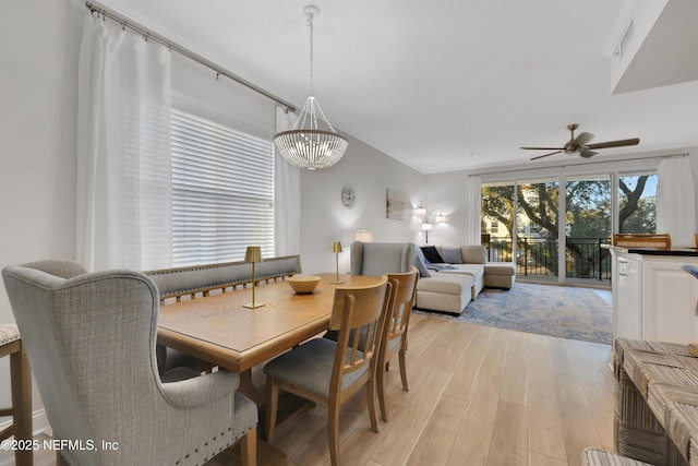 2003 Windjammer Ln, Saint Augustine, FL 32084 - dining room with ceiling fan with notable chandelier and light hardwood / wood-style flooring