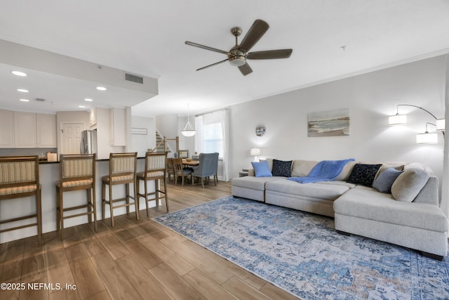 2003 Windjammer Ln, Saint Augustine, FL 32084 - living room featuring ceiling fan, ornamental molding, and hardwood / wood-style flooring