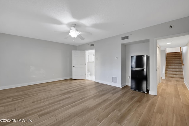2003 Windjammer Ln, Saint Augustine, FL 32084 - spare room with light wood-type flooring, ceiling fan, and a textured ceiling