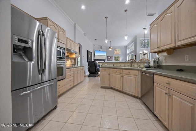 kitchen featuring appliances with stainless steel finishes, decorative light fixtures, light brown cabinetry, light tile patterned floors, and crown molding