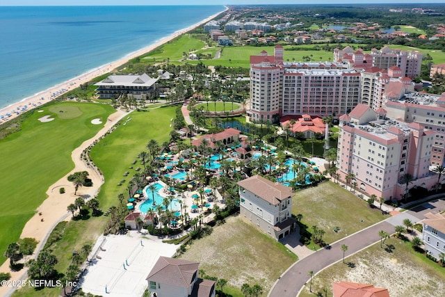 drone / aerial view with a beach view and a water view