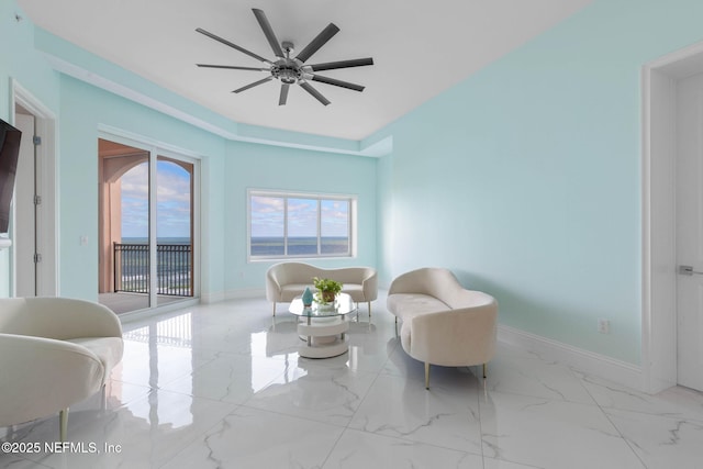 sitting room featuring ceiling fan