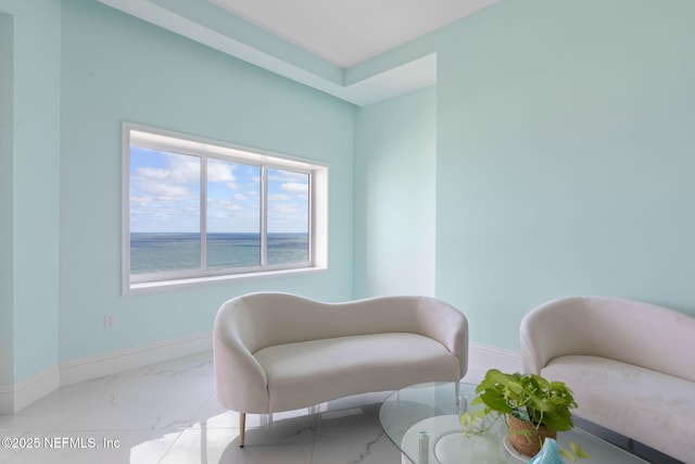 living area with a water view