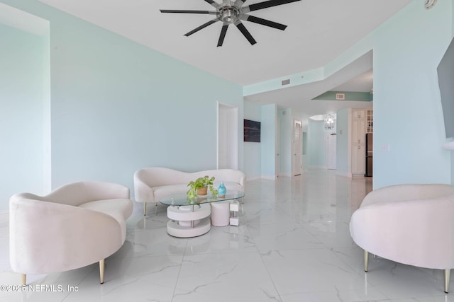 living area featuring ceiling fan