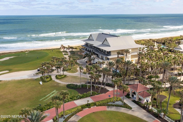 drone / aerial view with a water view and a beach view