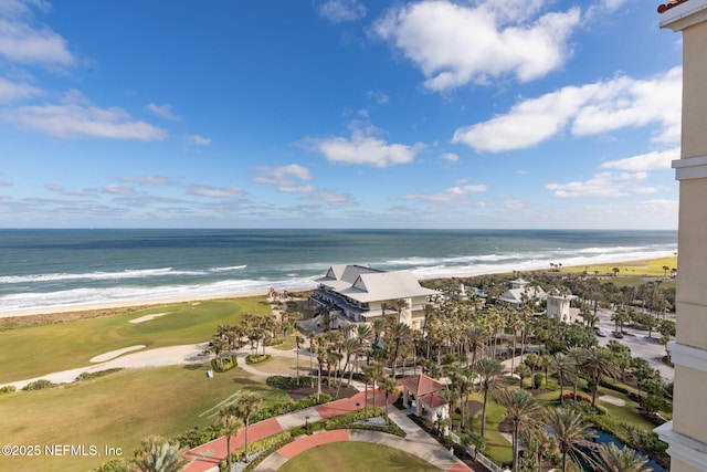 bird's eye view with a water view and a beach view