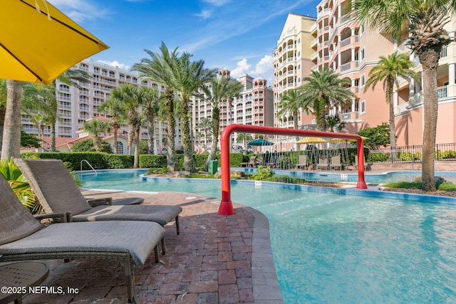 view of swimming pool featuring a patio area