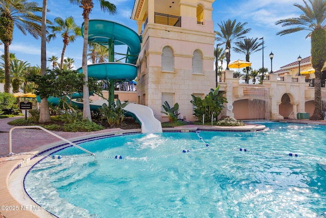 view of pool featuring a water slide