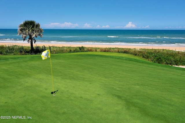 view of property's community with a view of the beach and a water view