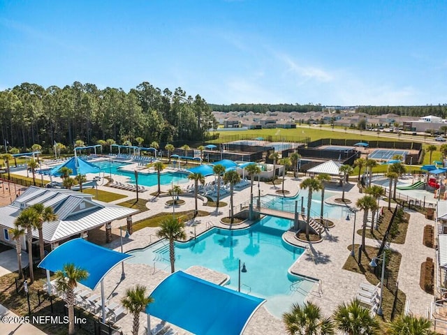 view of swimming pool featuring a patio area