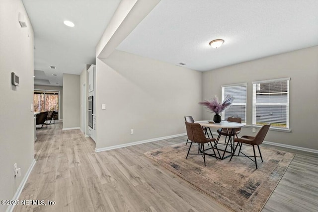 dining room with light hardwood / wood-style floors